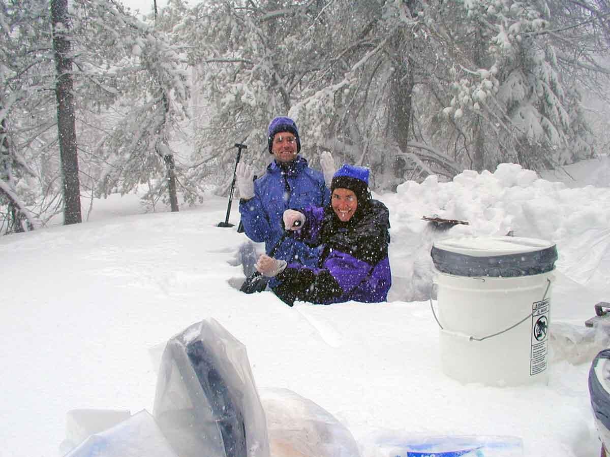 Workers collect snow sample at Apgar Lookout sampling site, Montana.