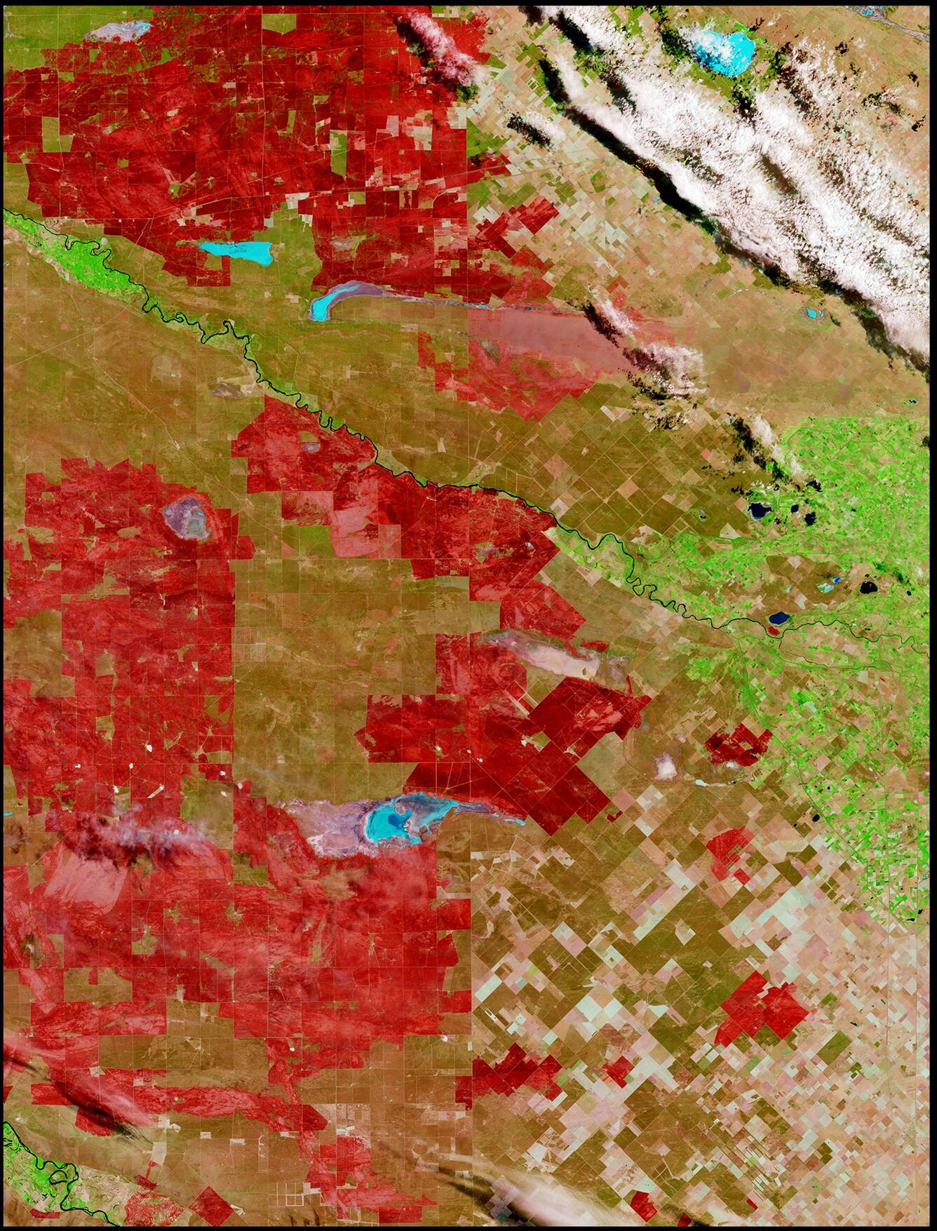 Image shows a satellite view of wildfire damage in Argentina