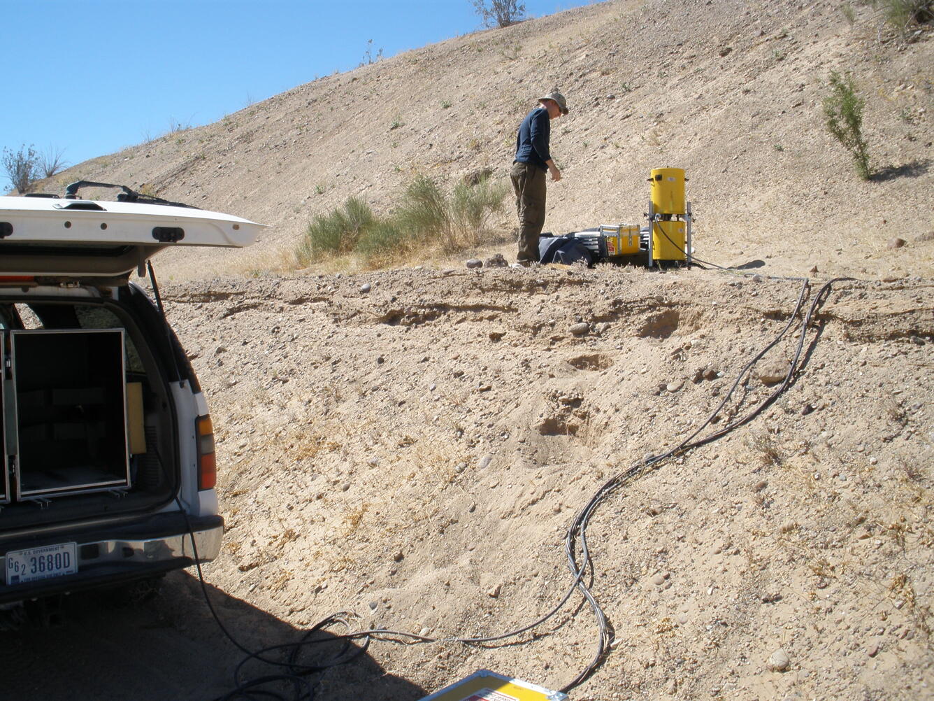 A USGS scientist deploys an absolute gravity meter.