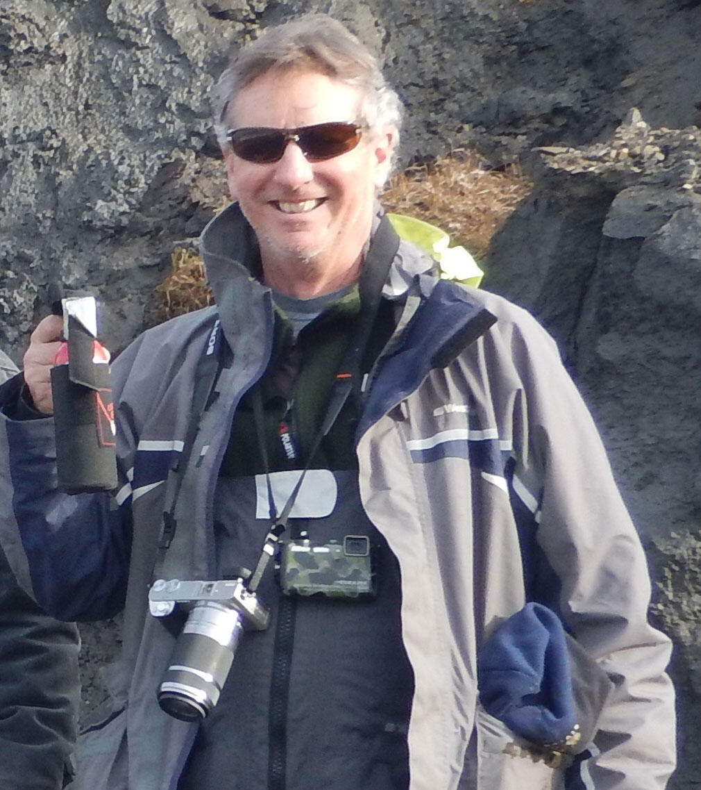 Bruce Richmond poses with camera equipment on Barter Island, Alaska in September, 2016.