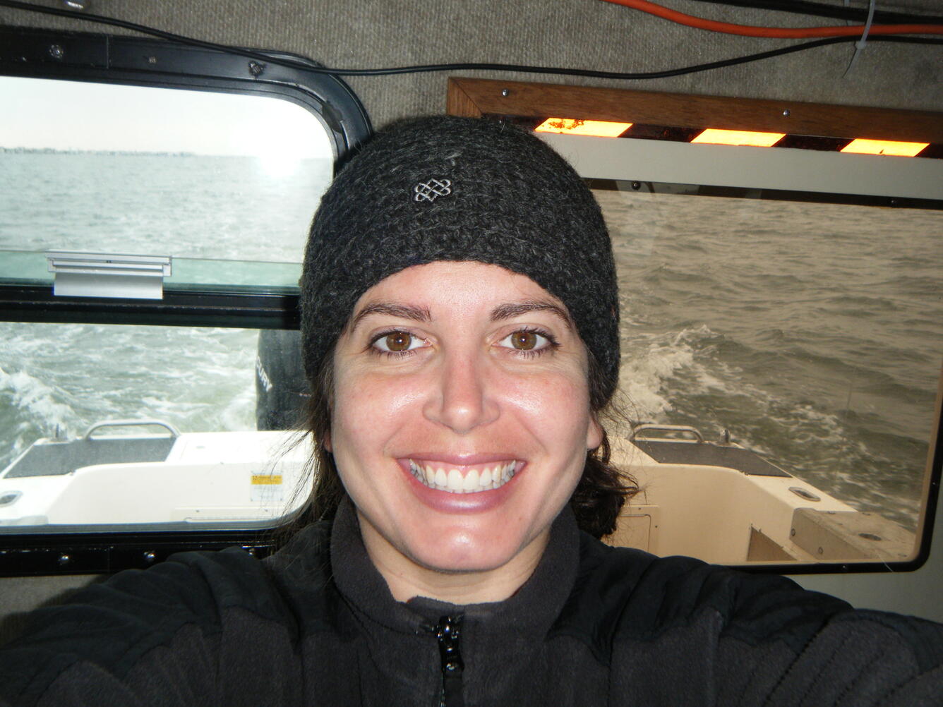 Photo of geologist, Jennifer Miselis, aboard USGS Research Vessel (R/V) Raphael in Barnegat Bay, NJ