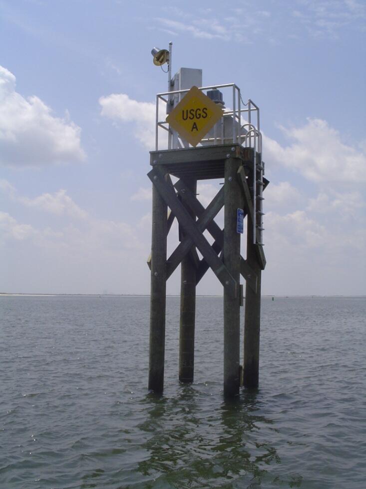 Wooden pylon tower housing a USGS tide sensor in Little Egg Harbor Inlet.