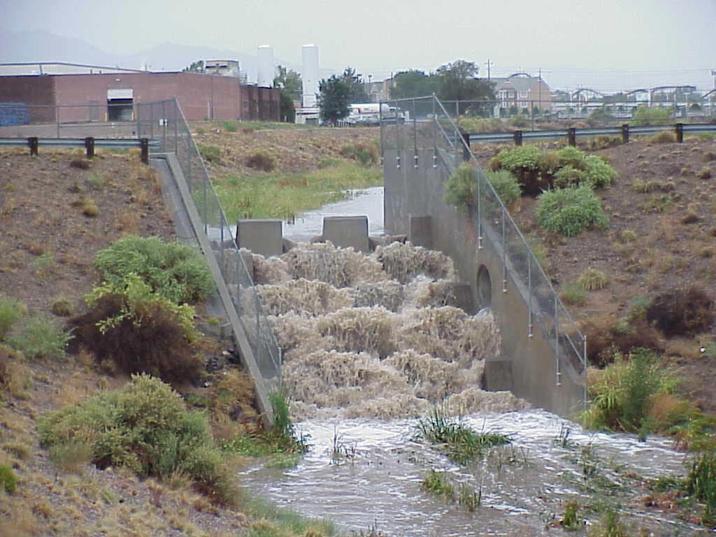 September 2002 stormwater flow; view oriented upstream at streamgage 08329870, Bear Arroyo at Jefferson Street site.