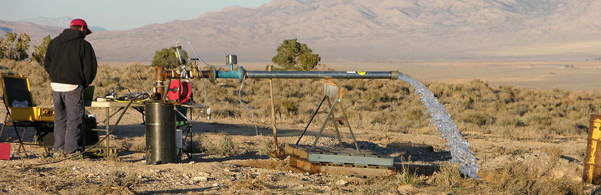 USGS scientist monitoring an aquifer test at Big Springs, Nevada