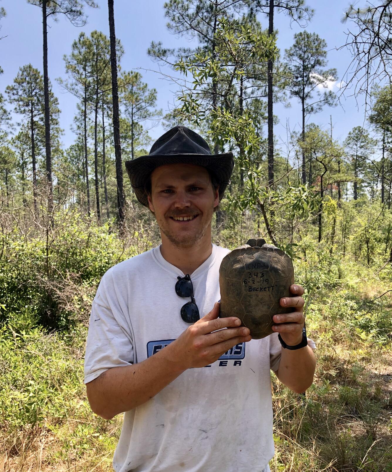 Photo of Brian Folt holding a turtle