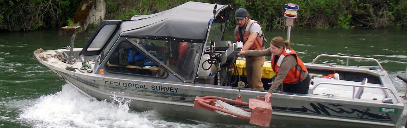 USGS technicians collecting bedload sediment samples