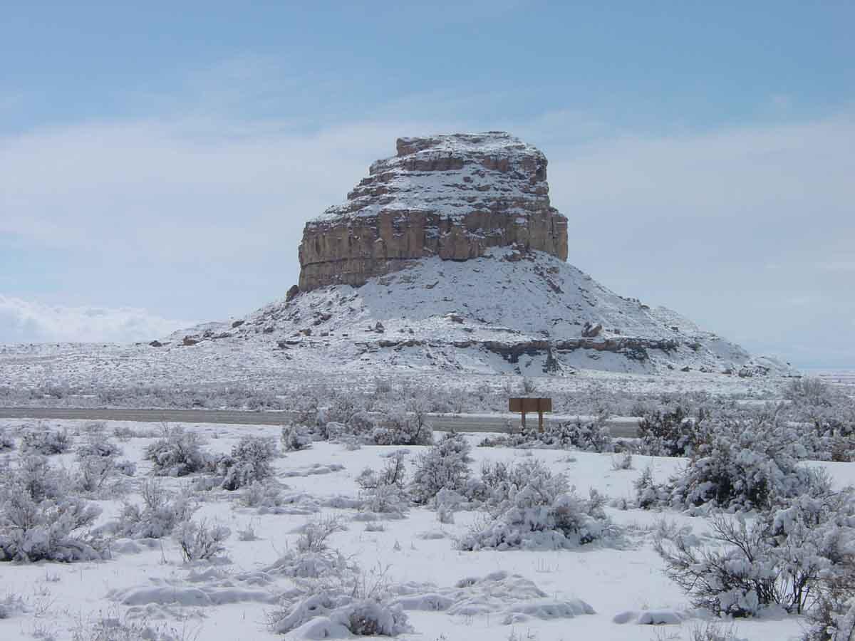 This is a photo of late winter snow covering the landscape near Fajada Butte at Chaco Canyon.