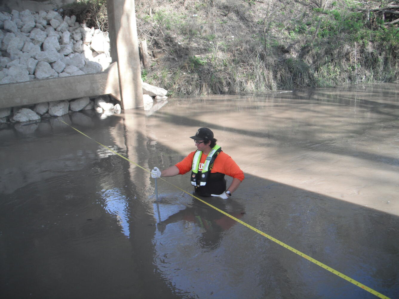 Collection of a bedload sample at U.S. Geological Survey station 08186500 Ecleto Creek near Runge, Texas.