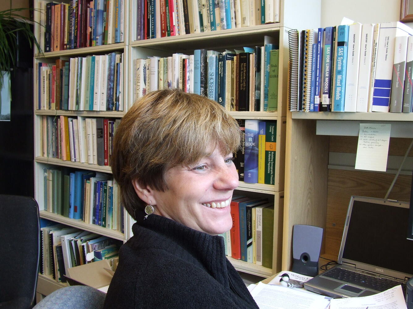 Colleen Handel sitting at her desk at the Alaska Science Center
