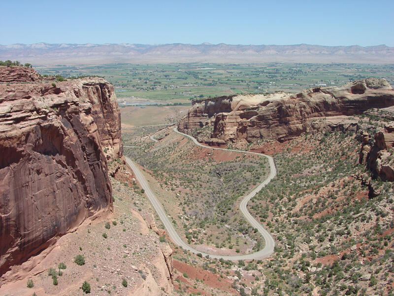 This is a photo of a view looking down on the Rim Rock Drive-the main route through the national monument. 