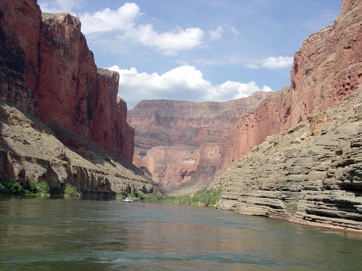 This is a photo of grayish ledges of Temple Butte Limestone & Muav Limestone cropping out along the Colorado River.