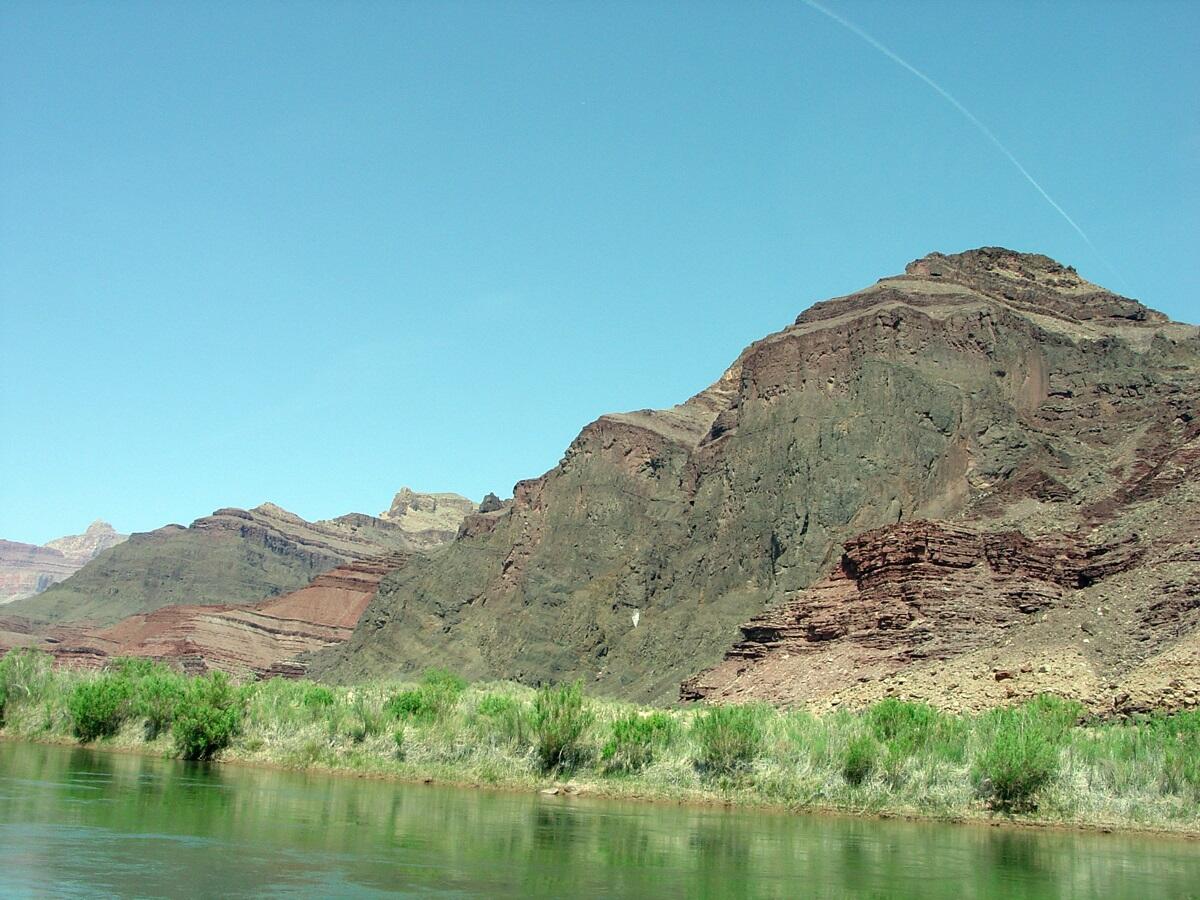 This is a photo of dark cliffs formed on exposed face of a Precambrian-age volcanic sill of Cardenas Basalt.
