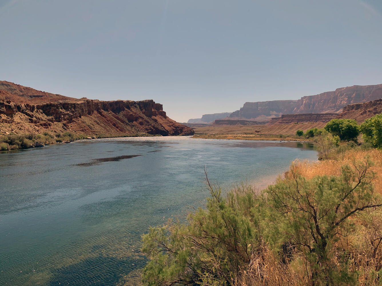 Photograph of the Colorado River as it enter the Grand Canyon. The Vermillion Cliffs can be seen in the distance.