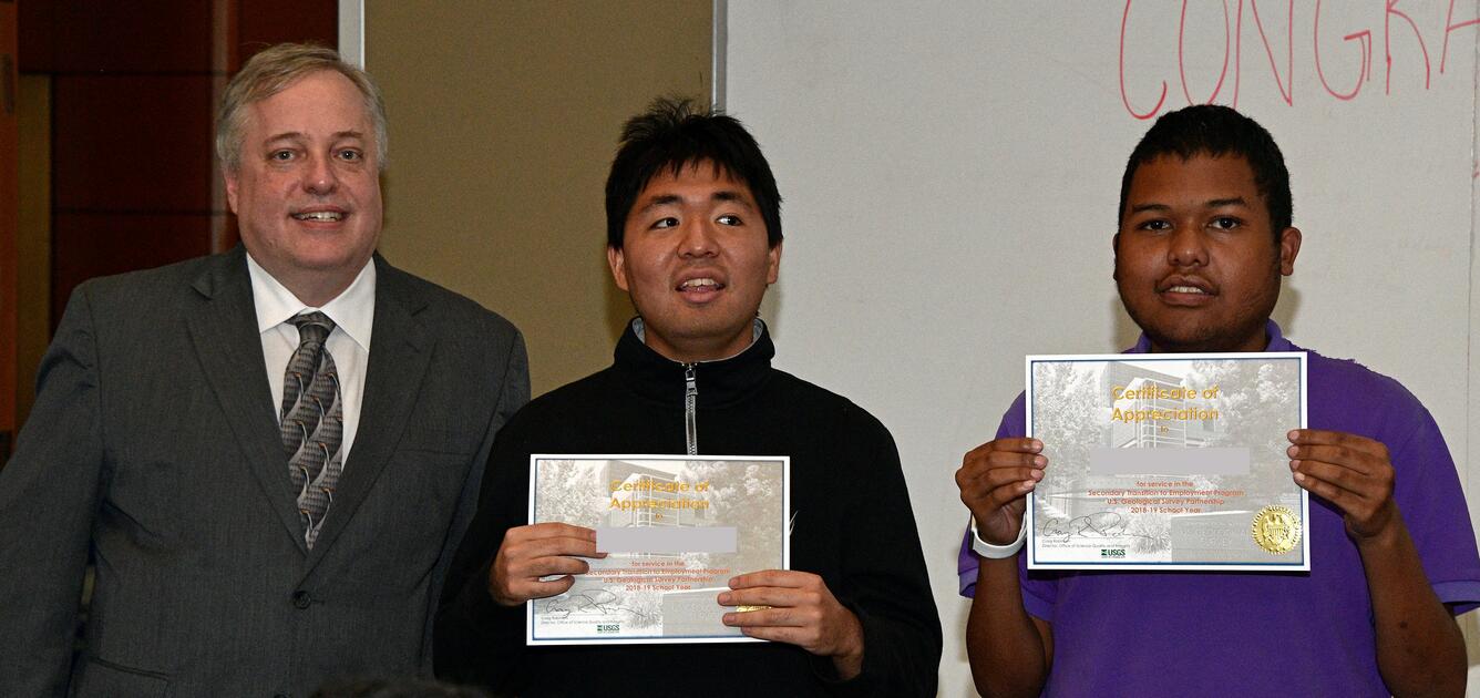 Photo of two STEP-UP students with OSQI Director Craig Robinson