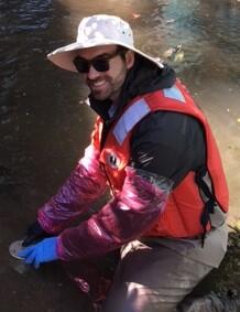 Matthew Cashman collecting bed sediment at Sausal Creek, California, for California stream quality assessment of NAWQA