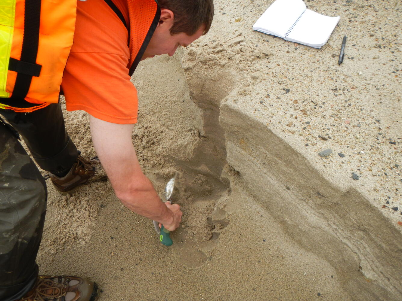 Collecting samples of sand along the bank of the Niobrara River, Nebr.