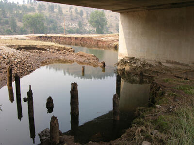 Bridge abutments scoured by the Battle Creek flood