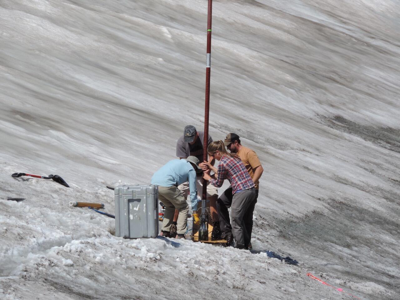 Researchers Pulling a Deep Ice Core Segment