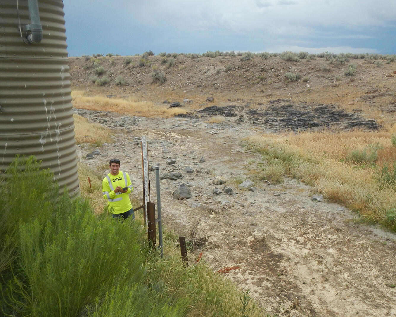 USGS scientist checking a streamgage