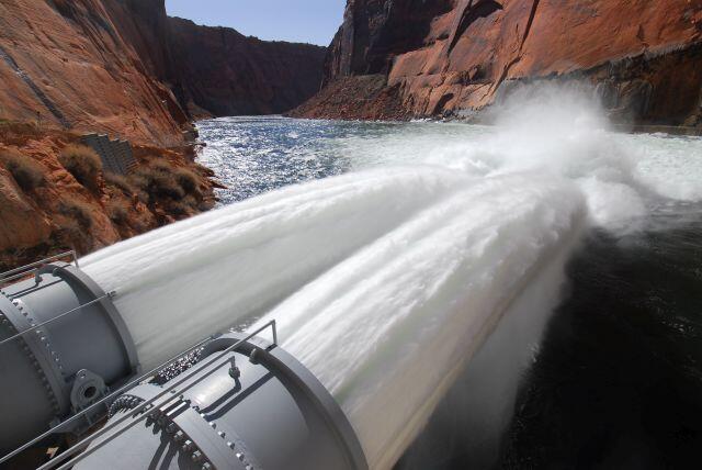 Glen Canyon Dam jet tubes releasing water into the Colorado River for a high flow experiment.