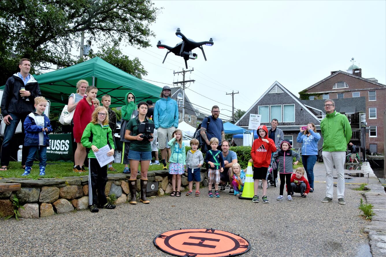 Image of a done landing on a target at the 2017 Woods Hole Science Stroll