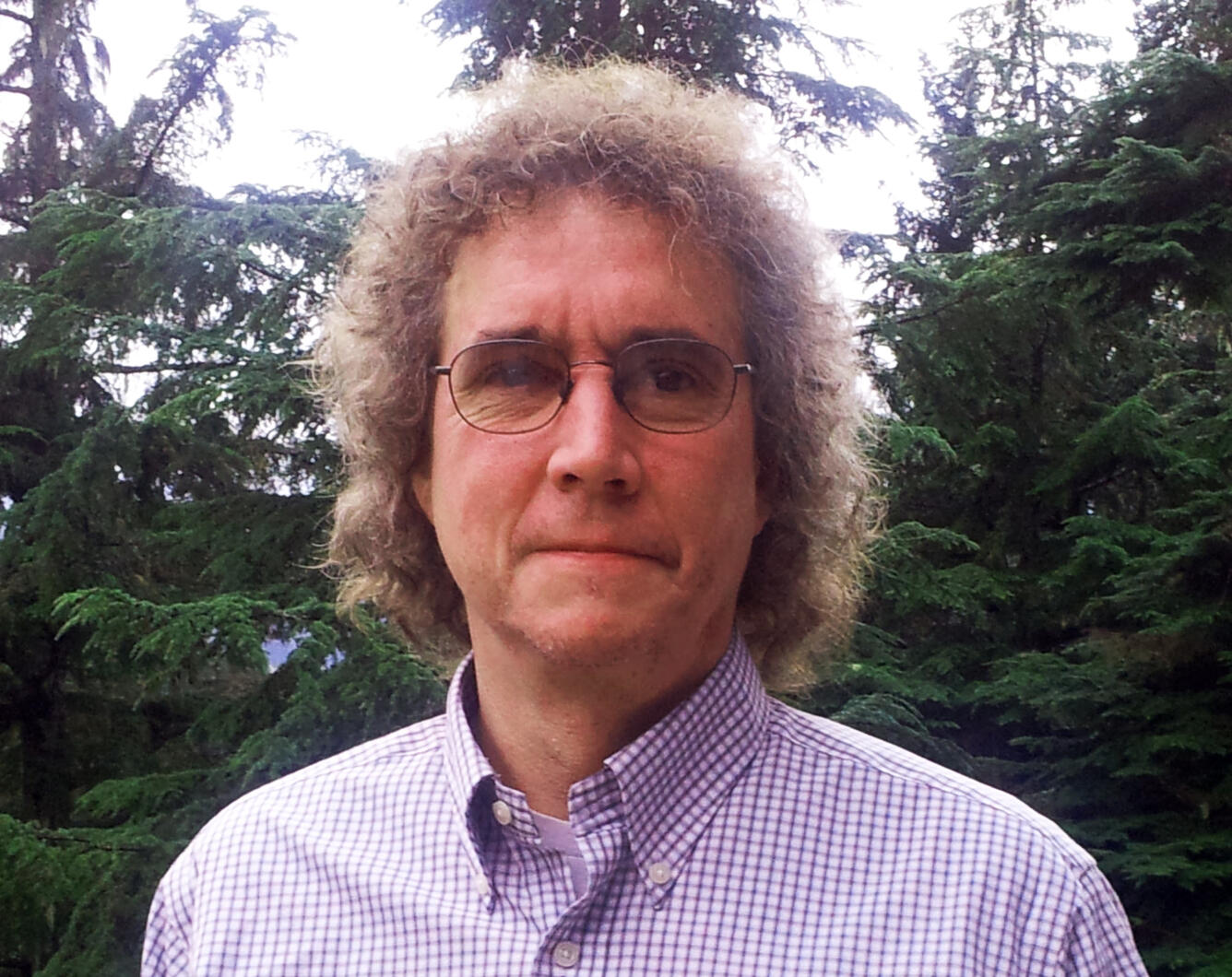 Dave Douglas standing in front of trees in Juneau, Alaska