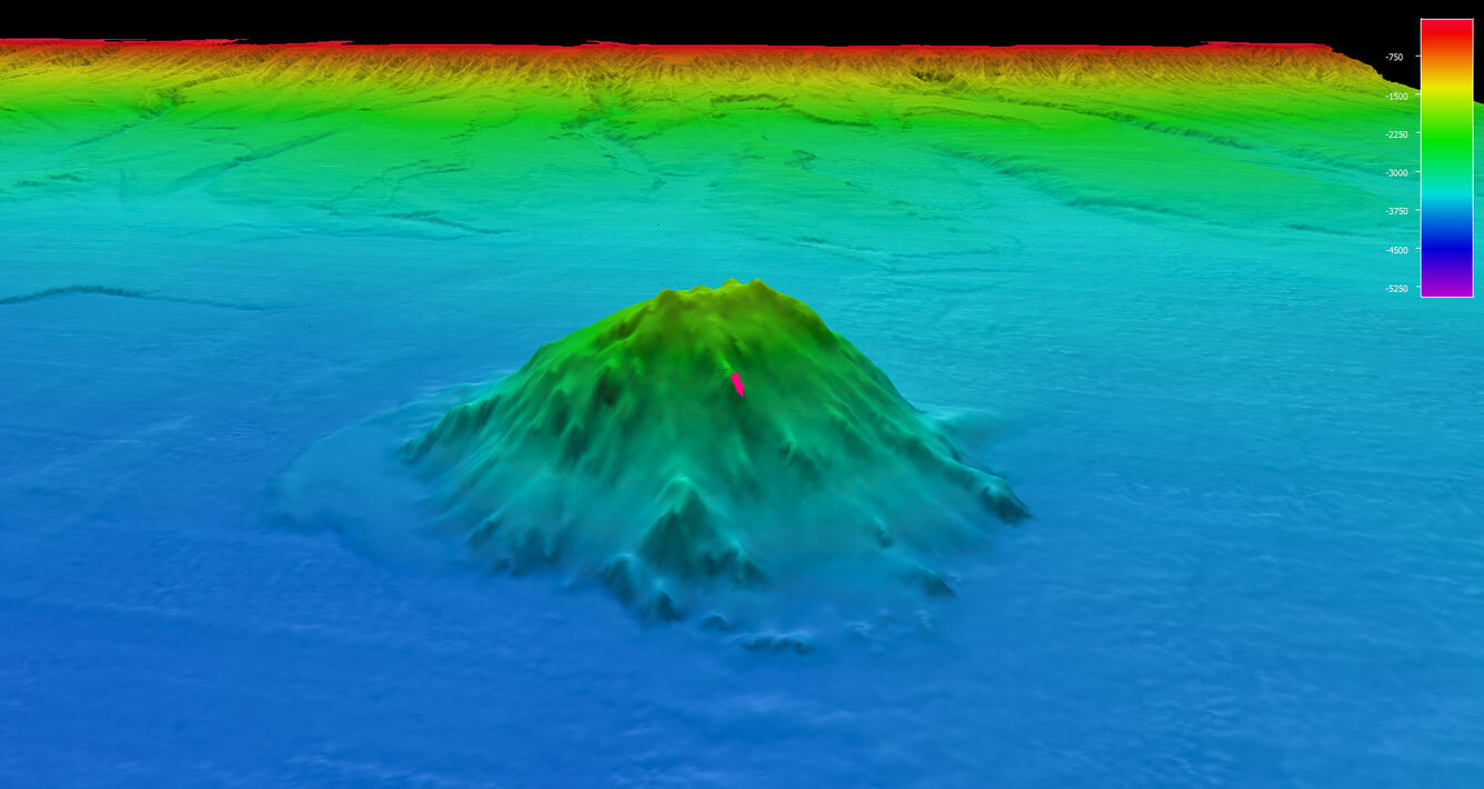 blue-hued image of seamount under the ocean