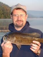 Don Dennerline, CRU Senior Program Biologist holding a smallmouth bass caught from the Potomac River, VA.