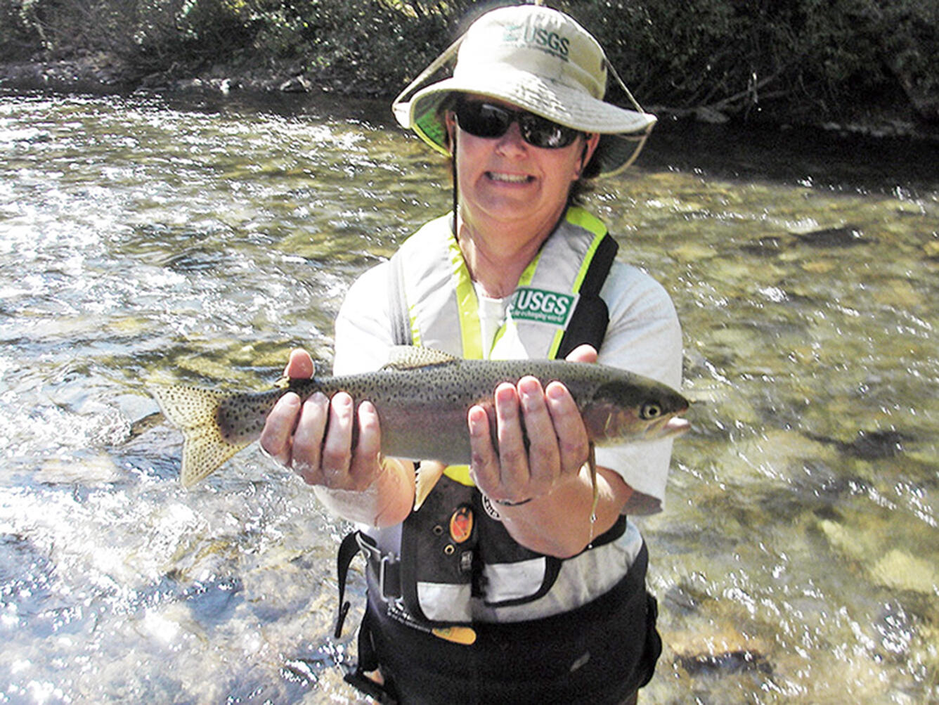 USGS biologist with rainbow trout from the Big Wood River, Idaho