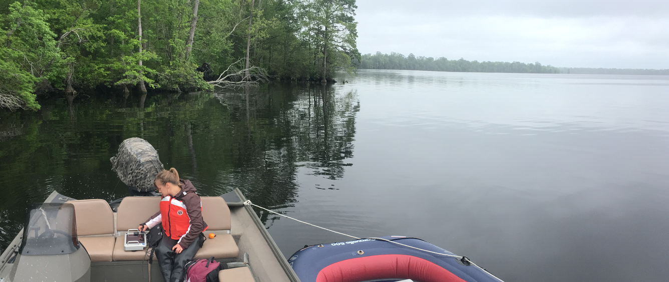 A Researcher collects ground penetrating radar (GPR) data while on Lake Drummond 