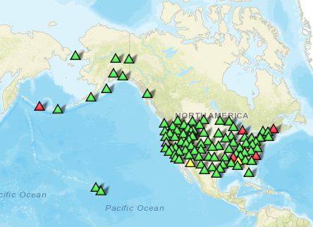 US map with green symbols for seismic station locations