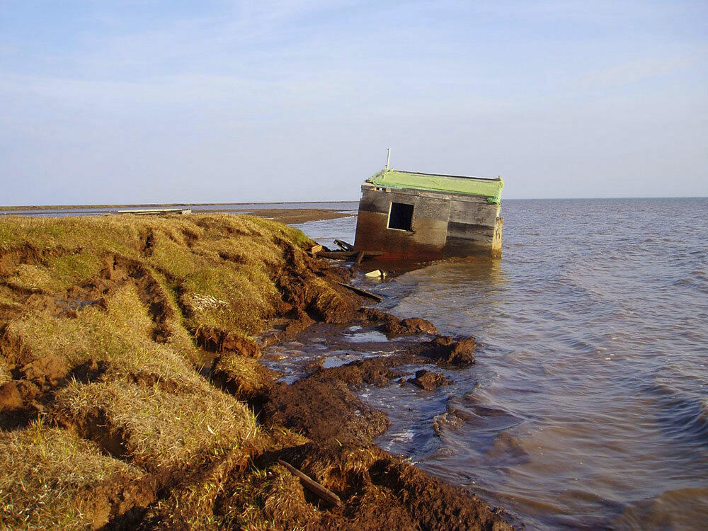 A cabin along Alaska's Arctic coast was recently washed into the ocean because the bluff it was sitting on eroded away.