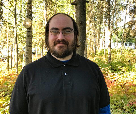 Man standing in trees