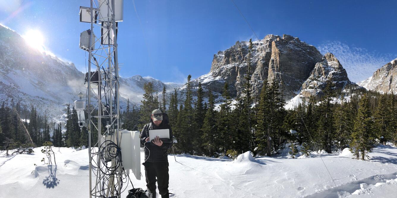 Dr. Graham Sextone downloading weather station data in Rocky Mountain National Park