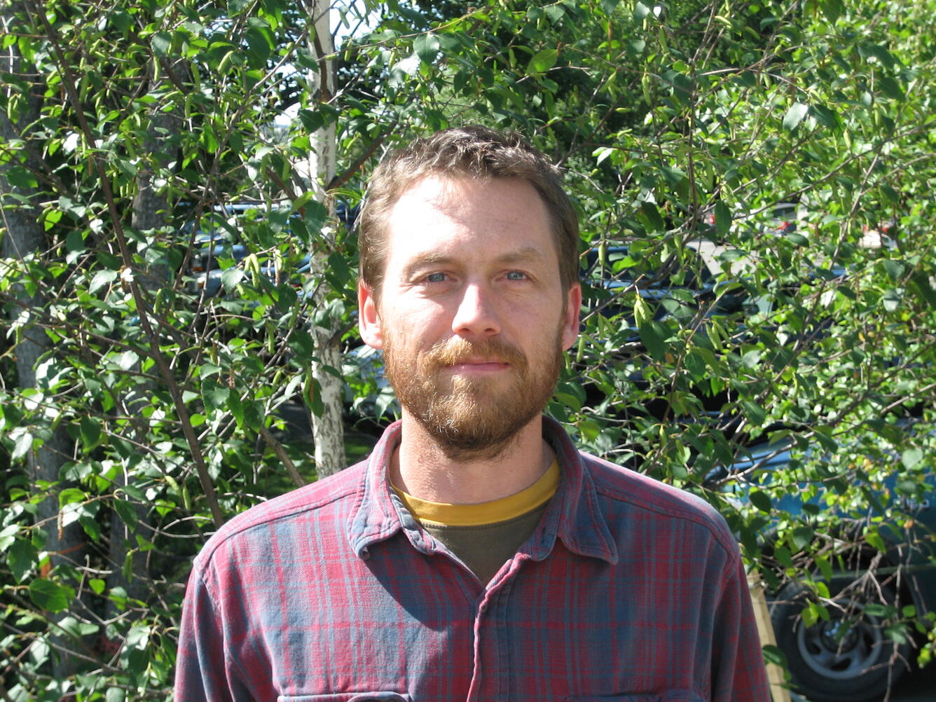 Evan Thoms in front of the USGS building in Anchorage, Alaska