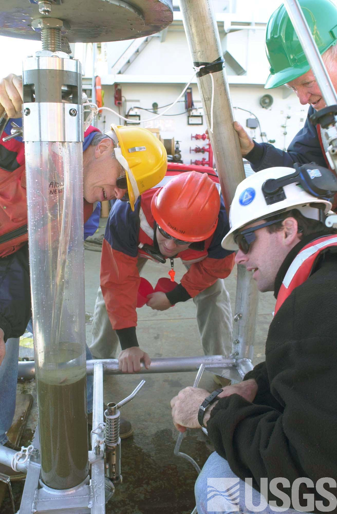 Syphoning water above the undisturbed sediment surface prior to subsampling