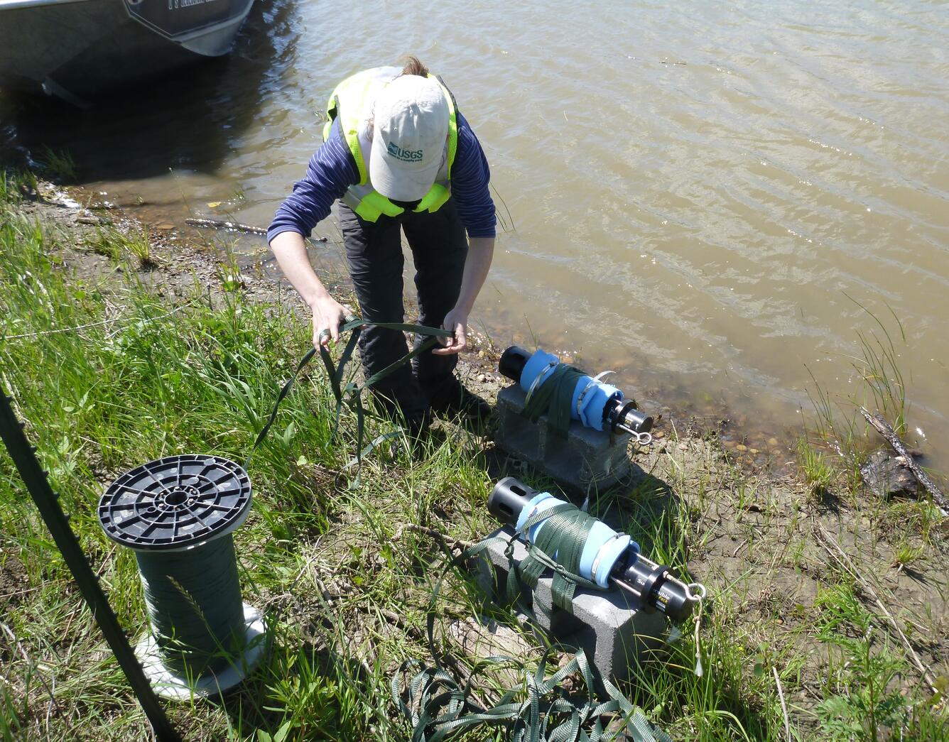 Scientist retrieving a fluorometer