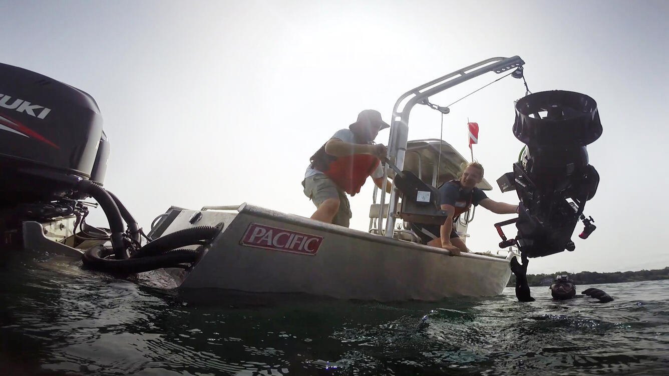 Lowering the dive camera system into the water in Lake Ontario