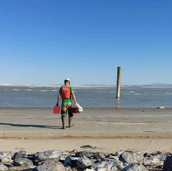 Hydrotech carries equipment across beach to Great Salt Lake 