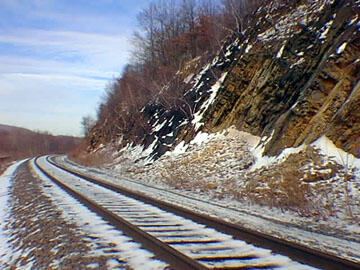 This is a photo of exposures of steeply dipping Middle Devonian sandstone & shale along the Conrail tracks in Highland Mills, NY