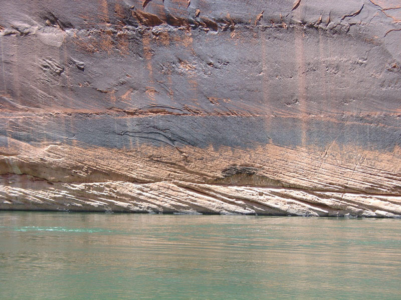 This is a photo of cross-bedded sandstone with desert varnish.