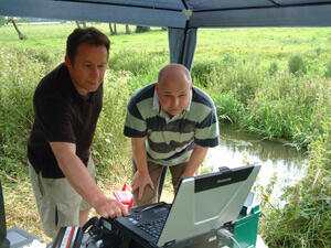 Dr. Andrew Binley (Lancaster University) and Dr. Nigel Cassidy (Keele University) observe real-time data collection during FO-DT