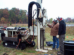 Installing one of seven direct-push wells that will be used for borehole electrical-resistivity surveys at the study area.