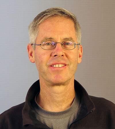 Photo of a man smiling.