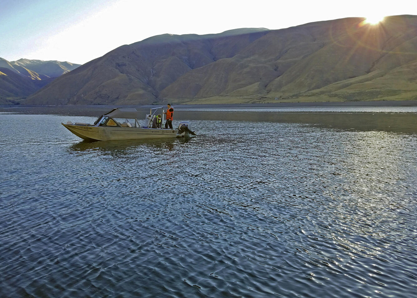 Jake Ogorek and John DeWild collect early morning sediment cores on Brownlee Reservoir. 
