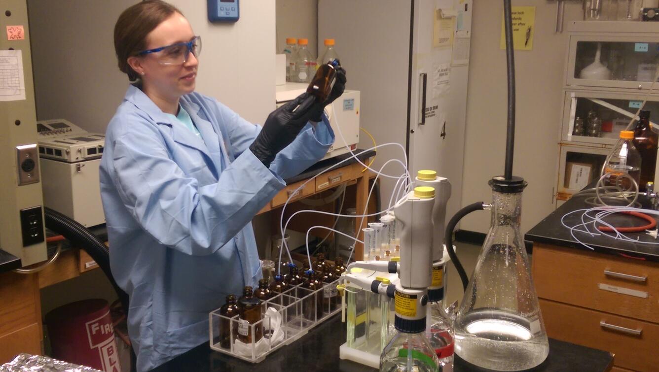 USGS Scientist using an instrument to produce results