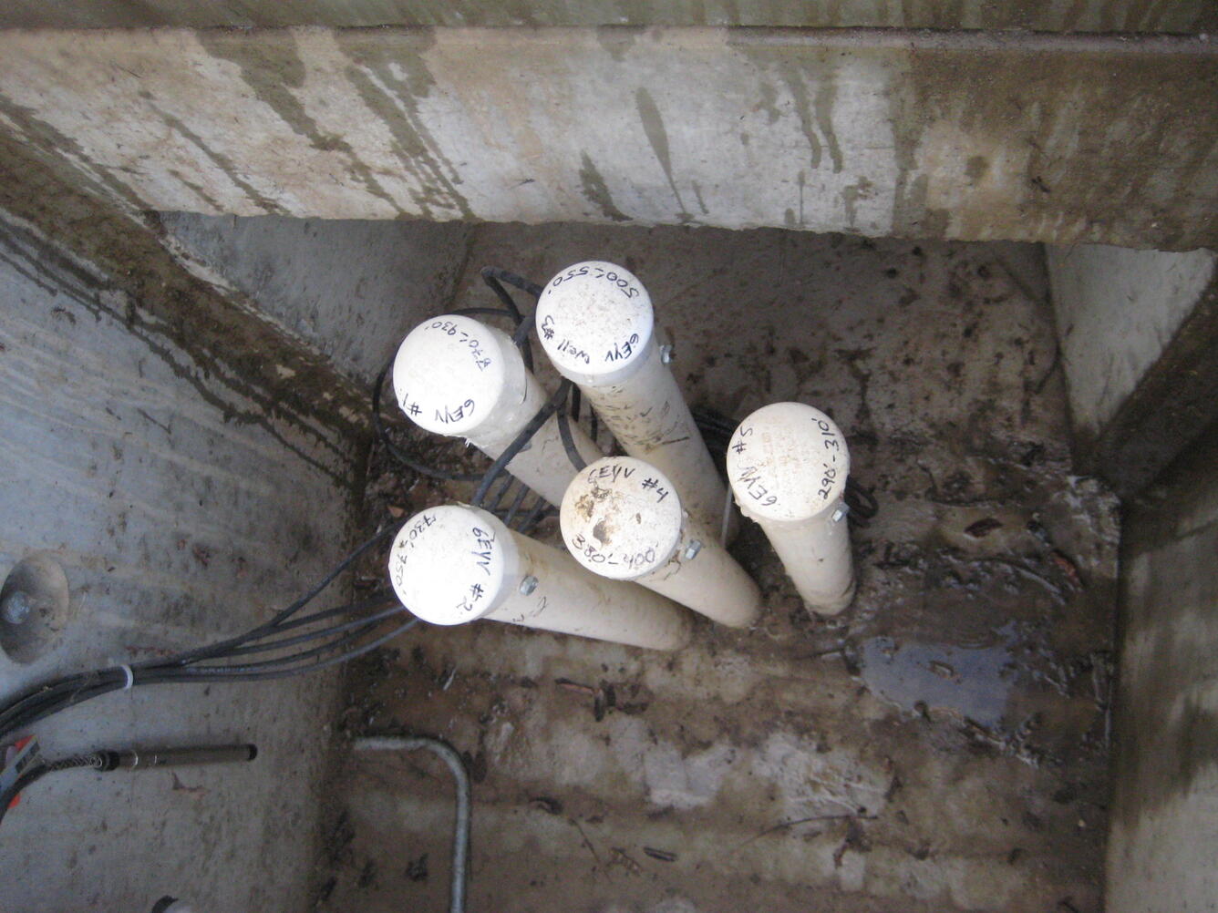 Photo of YV6E inside well vault of well casings