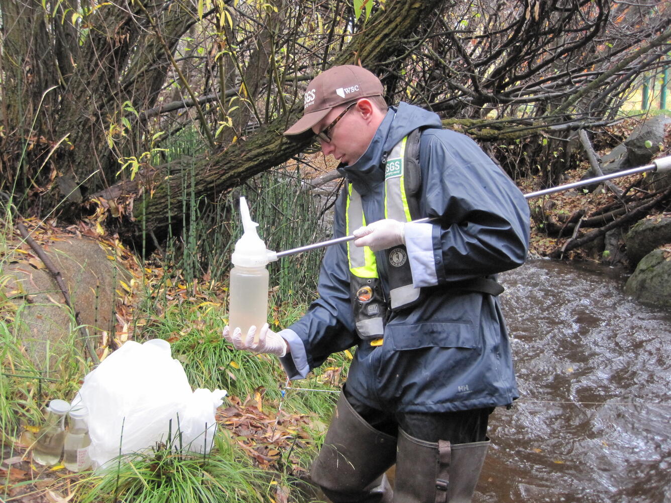 USGS scientist collecting water-quality samples from a stream in the Lake Tahoe Basin