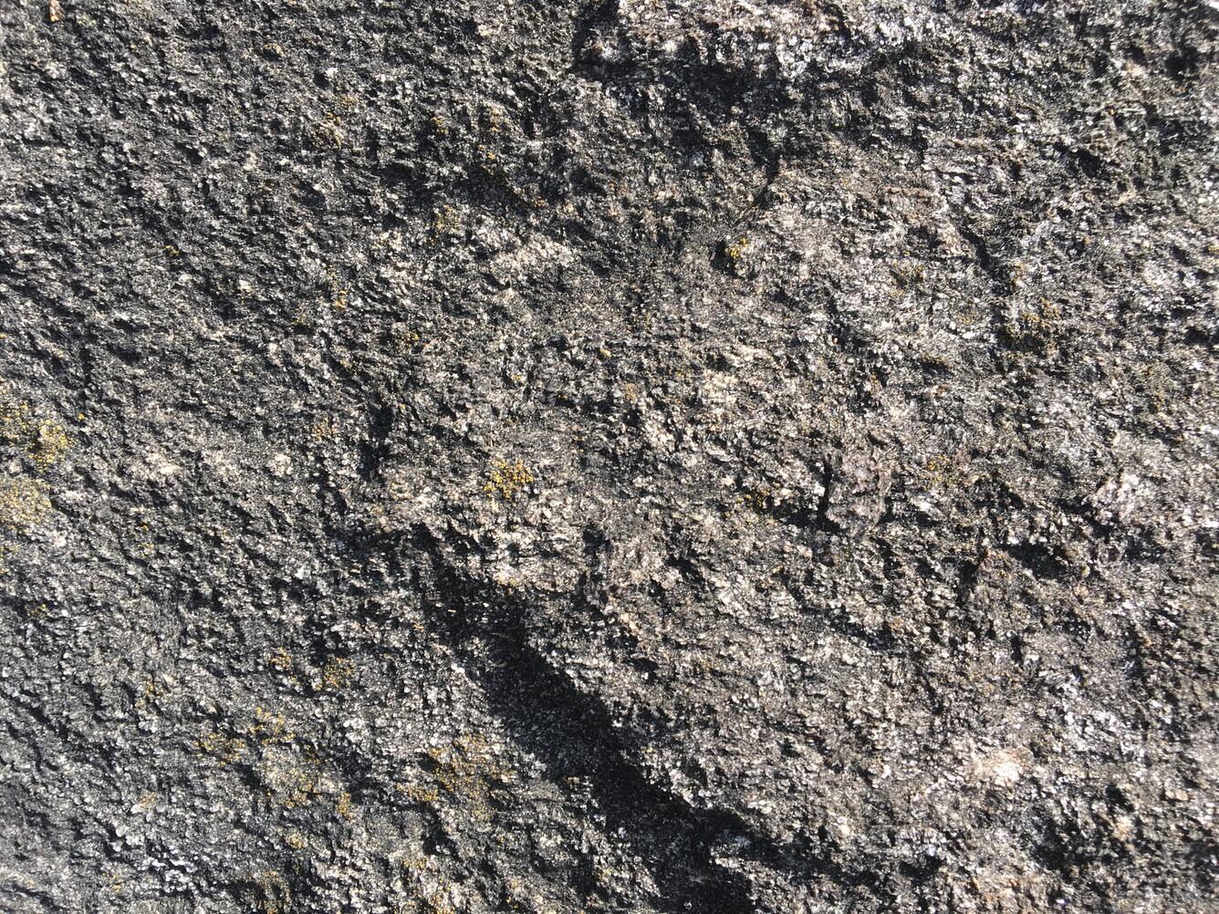 Image shows a detail shot of marble with diopside crystals