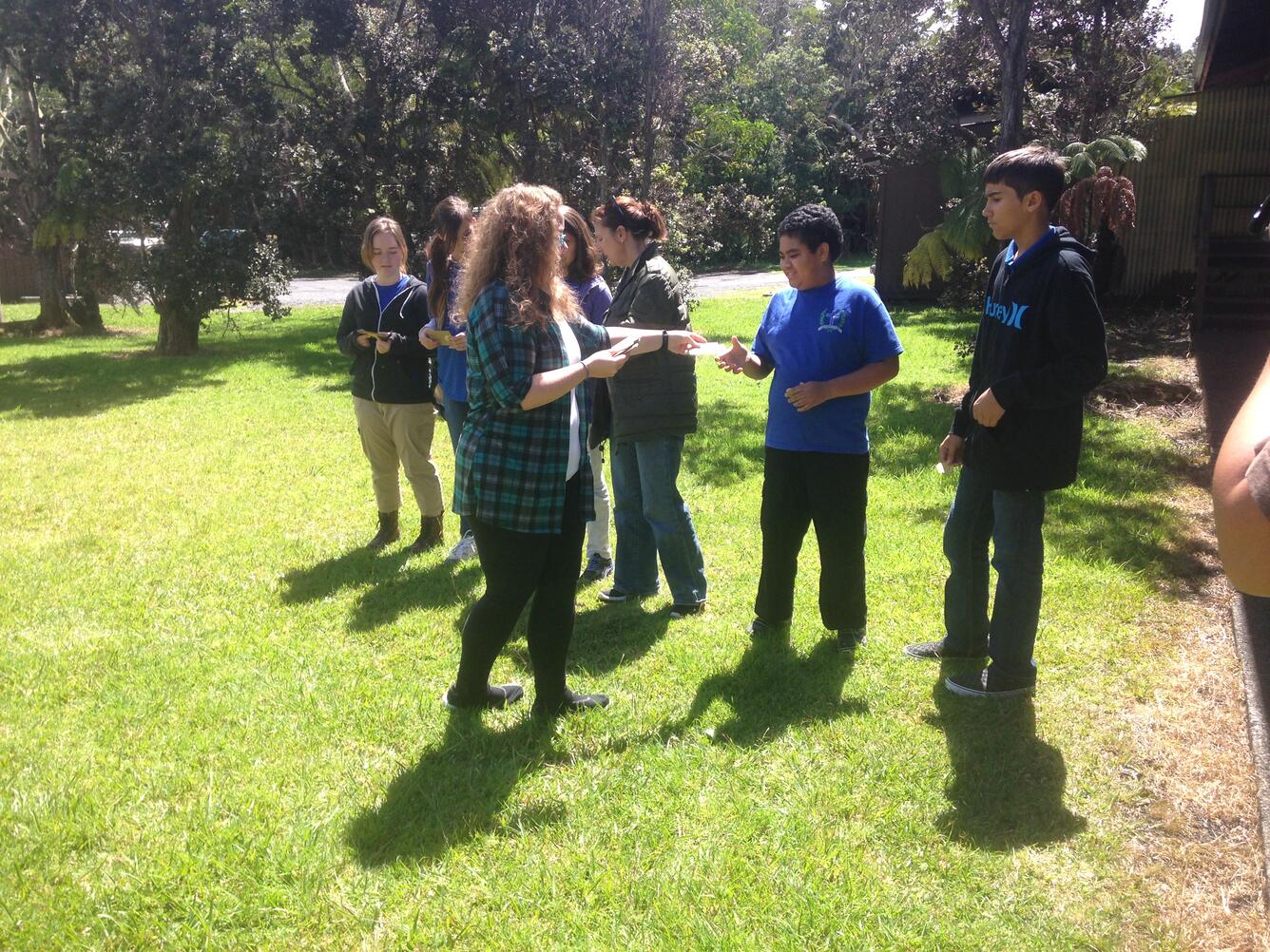 Research technician leads a group of kids in a genetics game